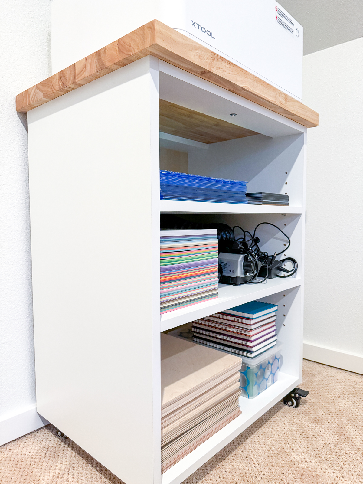 craft supplies on the shelves of the DIY craft cabinet